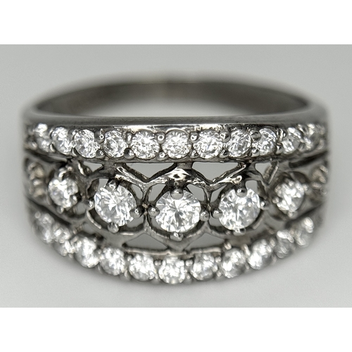 738 - A stunning 14K white gold CZ stone set ring. Total weight 3.7G. Size Q/R.