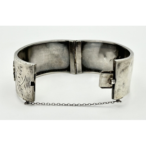 745 - An antique sterling silver click -on bangle (include safety chain). Rose gold border and yellow gold... 