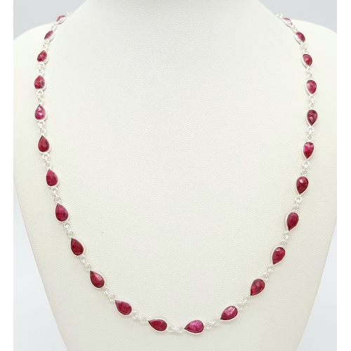 750 - A Pear Cut Ruby Gemstone Necklace. Set in 925 Silver. 58cm. 
CD-1962.