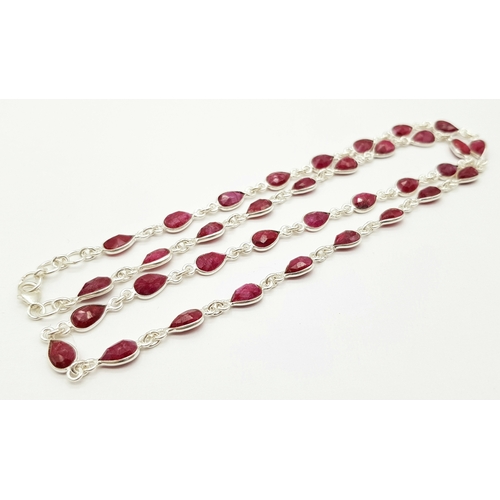 750 - A Pear Cut Ruby Gemstone Necklace. Set in 925 Silver. 58cm. 
CD-1962.