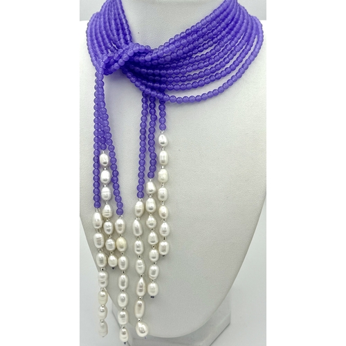 778 - An Alexandrite and Pearl Scarf Necklace. Each strand of three measuring 128cm.