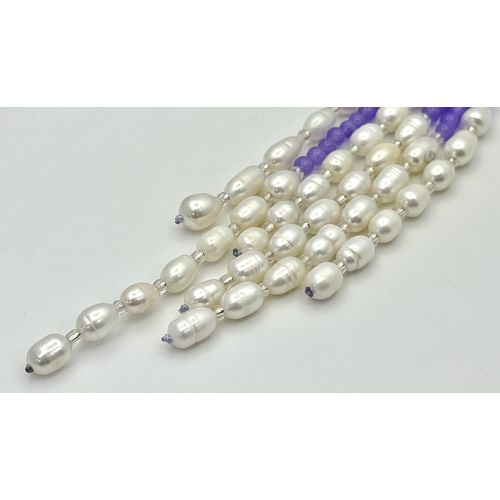 778 - An Alexandrite and Pearl Scarf Necklace. Each strand of three measuring 128cm.