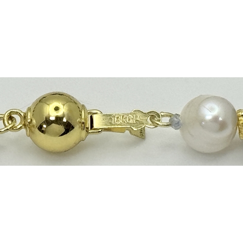 884 - A Lapis Lazuli and Pearl Matinee Length Necklace. 7/8mm pearls and lapis beads. 90cm length. Gilded ... 