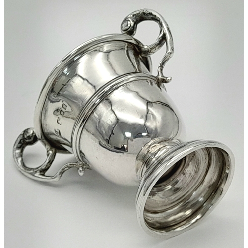 893 - An antique sterling silver miniature trophy cup. Full London hallmarks, 1924. Total weight 20.1G. He... 