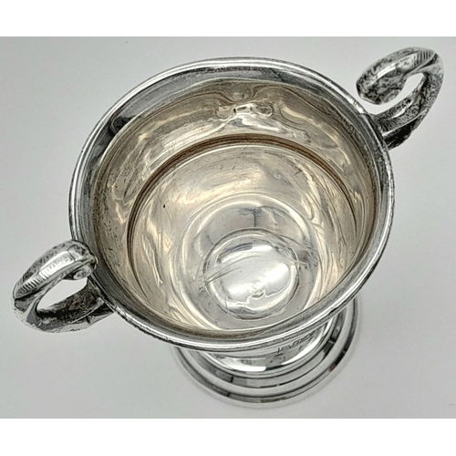 893 - An antique sterling silver miniature trophy cup. Full London hallmarks, 1924. Total weight 20.1G. He... 