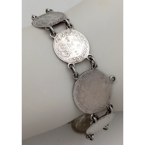 907 - A vintage silver British coin link bracelet. Total weight 16.3G. Total length 20cm.