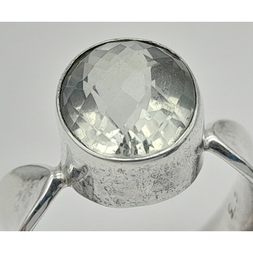 928 - A 925 silver Oval faceted Green Amethyst ring. Total weight 6.9G. Size O/P.