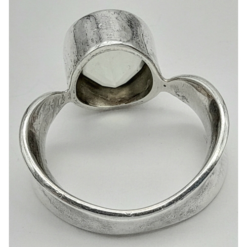 928 - A 925 silver Oval faceted Green Amethyst ring. Total weight 6.9G. Size O/P.