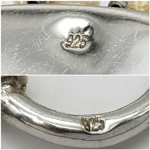 977 - A gorgeous 925 silver Natural Shell and Pearls multi-strand T-bar necklace. Total weight 132.5G. Tot... 