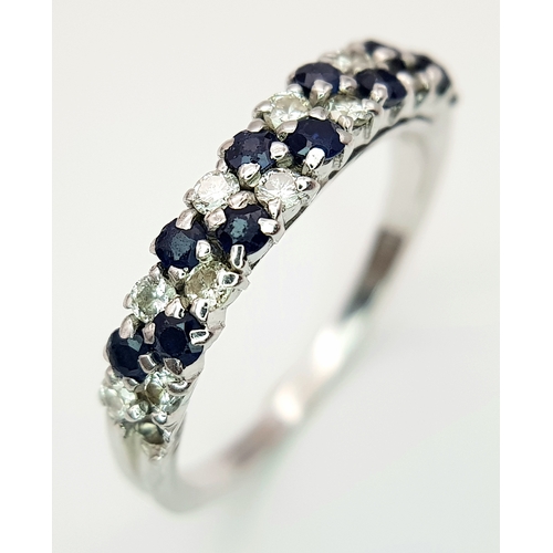 138 - AN 18K WHITE GOLD DIAMOND AND SAPPHIRE 2 ROW RING. TOTAL WEIGHT 3.1G. SIZE P. SC 9050