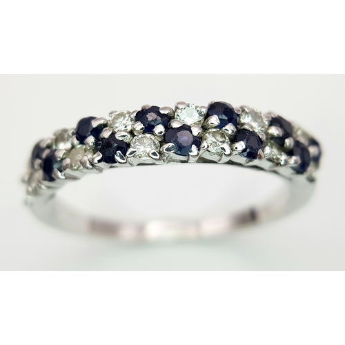 138 - AN 18K WHITE GOLD DIAMOND AND SAPPHIRE 2 ROW RING. TOTAL WEIGHT 3.1G. SIZE P. SC 9050