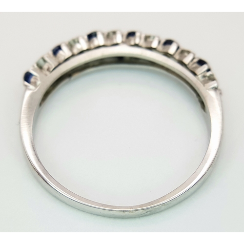 138 - AN 18K WHITE GOLD DIAMOND AND SAPPHIRE 2 ROW RING. TOTAL WEIGHT 3.1G. SIZE P. SC 9050