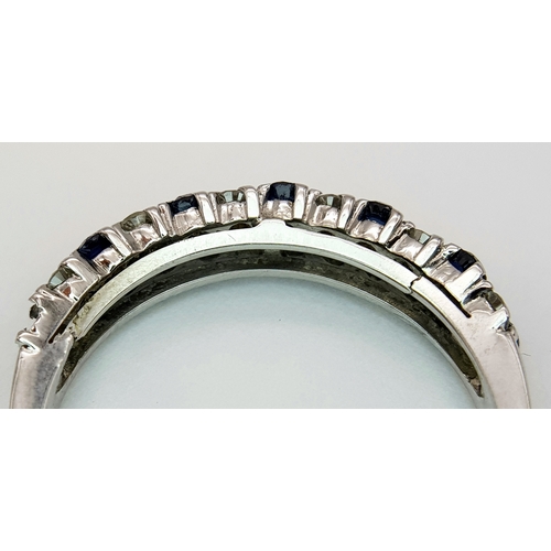 138 - AN 18K WHITE GOLD DIAMOND AND SAPPHIRE 2 ROW RING. TOTAL WEIGHT 3.1G. SIZE P. SC 9050