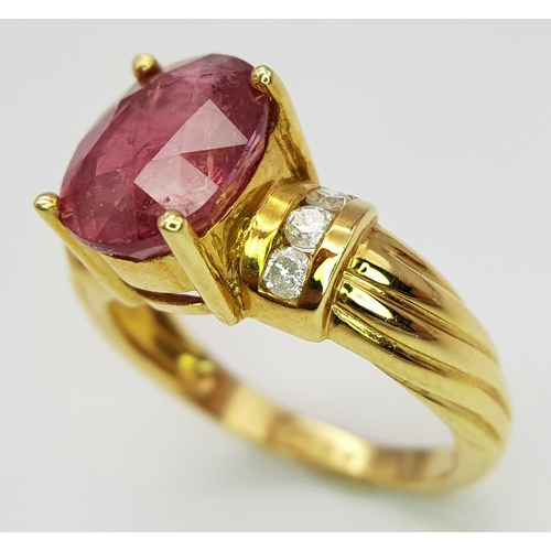 142 - An 18K Yellow Gold Ruby and Diamond Ring. A Natural, Unheated 2ct oval cut ruby with six round brill... 