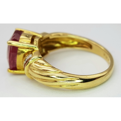 142 - An 18K Yellow Gold Ruby and Diamond Ring. A Natural, Unheated 2ct oval cut ruby with six round brill... 