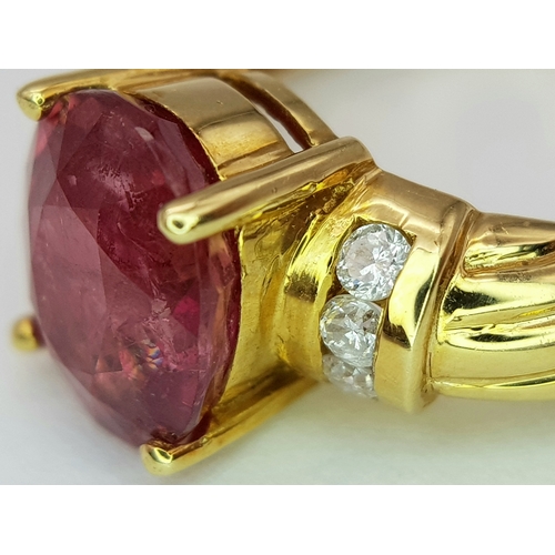142 - An 18K Yellow Gold Ruby and Diamond Ring. A Natural, Unheated 2ct oval cut ruby with six round brill... 