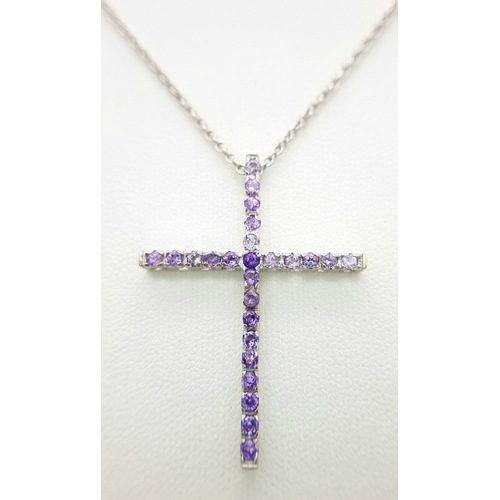 171 - An 18K White Gold Amethyst Set Cross on an 18K White Gold Chain. 4cm and 42cm. 6.8g total weight. Re... 