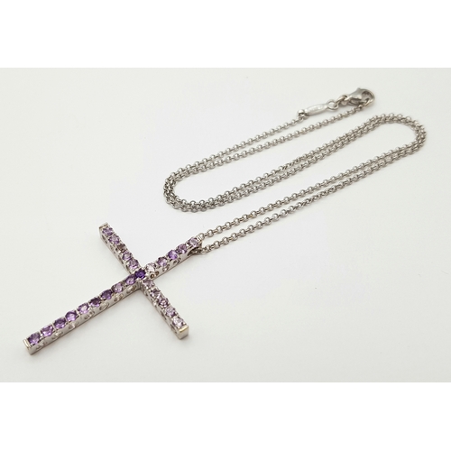 171 - An 18K White Gold Amethyst Set Cross on an 18K White Gold Chain. 4cm and 42cm. 6.8g total weight. Re... 