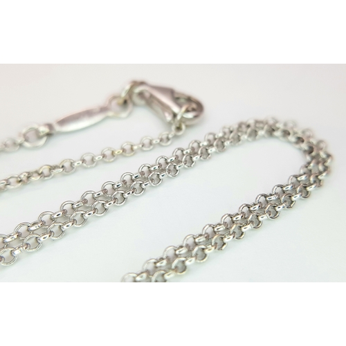 171 - An 18K White Gold Amethyst Set Cross on an 18K White Gold Chain. 4cm and 42cm. 6.8g total weight. Re... 