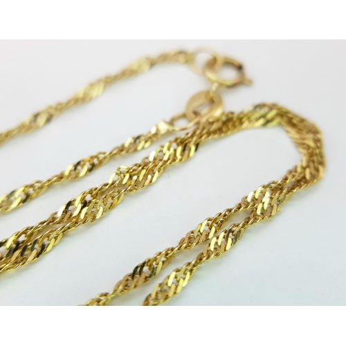 178 - A 9K Gold and Diamond Pendant on an 18K Gold Yellow Chain. Round brilliant cut diamond - 0.15ct. 1cm... 