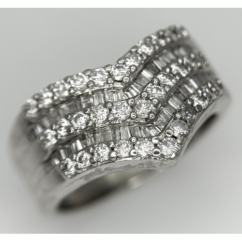 180 - AN 18K WHITE GOLD FIVE ROW DIAMOND CHEVRON SHAPED RING. 0.75CTW OF ROUND AND TAPERED BAGUETTE DIAMON... 
