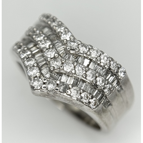 180 - AN 18K WHITE GOLD FIVE ROW DIAMOND CHEVRON SHAPED RING. 0.75CTW OF ROUND AND TAPERED BAGUETTE DIAMON... 