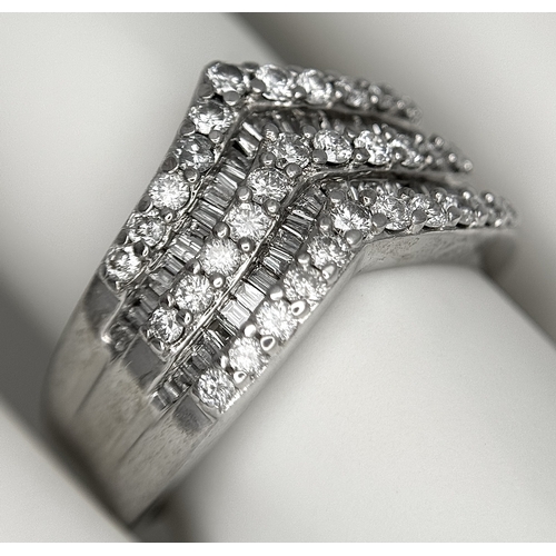 180 - AN 18K WHITE GOLD FIVE ROW DIAMOND CHEVRON SHAPED RING. 0.75CTW OF ROUND AND TAPERED BAGUETTE DIAMON... 