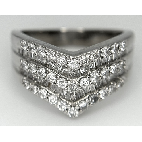 180 - AN 18K WHITE GOLD FIVE ROW DIAMOND CHEVRON SHAPED RING. 0.75CTW OF ROUND AND TAPERED BAGUETTE DIAMON... 