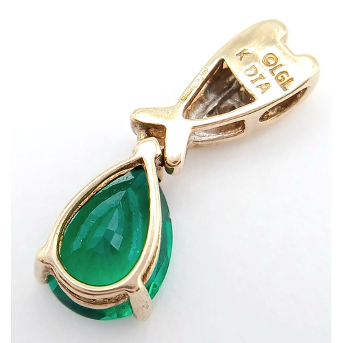 723 - A 9k yellow gold diamond and green stone pendant, 0.05ct diamond weight, total weight 1.3g. 2177I