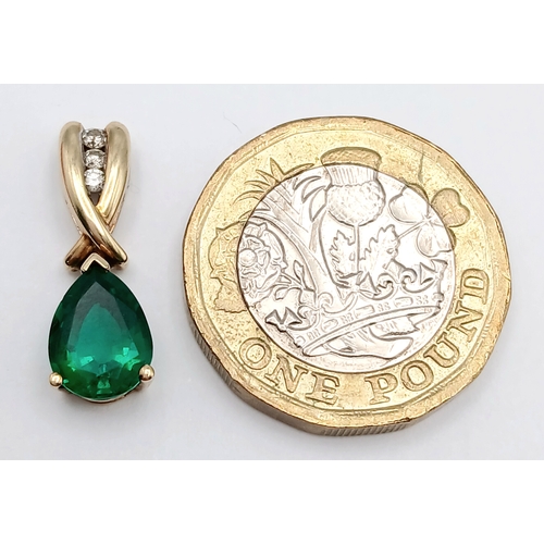 723 - A 9k yellow gold diamond and green stone pendant, 0.05ct diamond weight, total weight 1.3g. 2177I