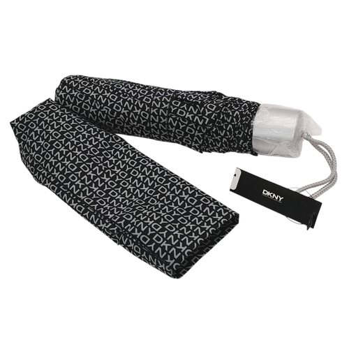 935 - A matching set of DKNY shoulder bag (34X18 cm), purse (19.5 X12 cm) and an umbrella. In very good co... 