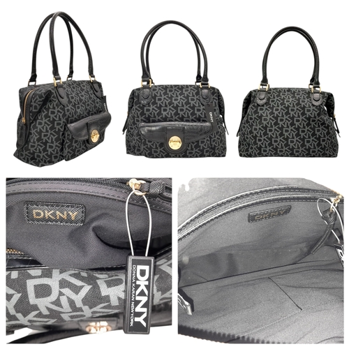 935 - A matching set of DKNY shoulder bag (34X18 cm), purse (19.5 X12 cm) and an umbrella. In very good co... 