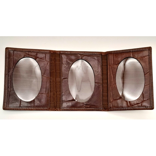 963 - A Mulberry burgundy cards and photos holder. 12 X 10 cm.