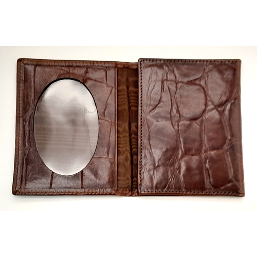 963 - A Mulberry burgundy cards and photos holder. 12 X 10 cm.