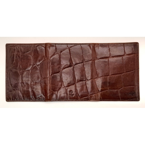 963 - A Mulberry burgundy cards and photos holder. 12 X 10 cm.