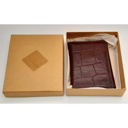 963 - A Mulberry burgundy cards and photos holder. 12 X 10 cm.