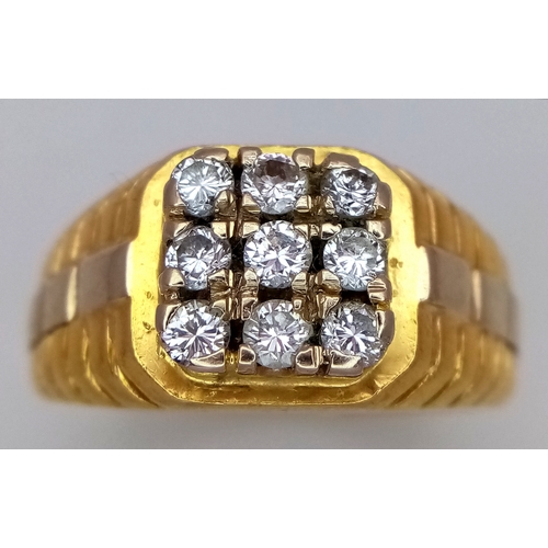 173 - AN 18K YELLOW GOLD DIAMOND SET RING. NINE ROUND BRILLIANT CUT DIAMONDS - 0.40CTW. 9G. SIZE T. SPSA-1... 