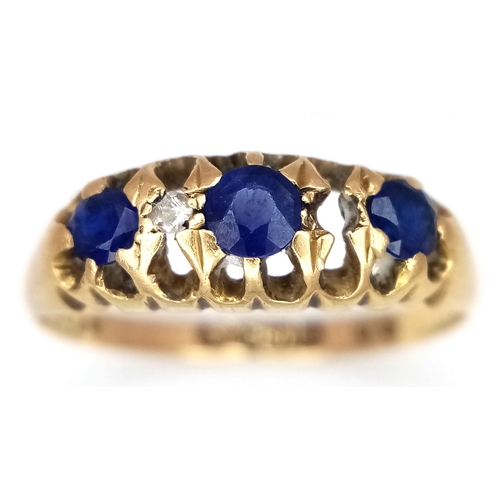 176 - AN 18K GOLD RING WITH SAPPHIRE AND DIAMONDS (ONE SMALL DIAMOND MISSING)      2.3gms    size N/O