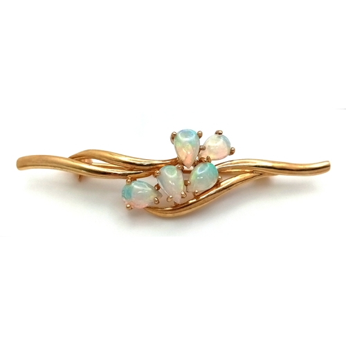 179 - A VERY ATTRACTIVE 9K GOLD BROOCH WITH 5 PEAR SHAPED FIRE OPALS .    3.5gms