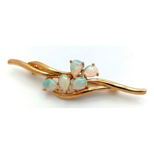 179 - A VERY ATTRACTIVE 9K GOLD BROOCH WITH 5 PEAR SHAPED FIRE OPALS .    3.5gms