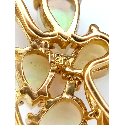 179 - A VERY ATTRACTIVE 9K GOLD BROOCH WITH 5 PEAR SHAPED FIRE OPALS .    3.5gms