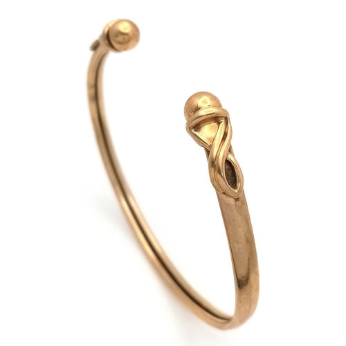186 - A 9K GOLD TORQUE BANGLE .     5.1gms