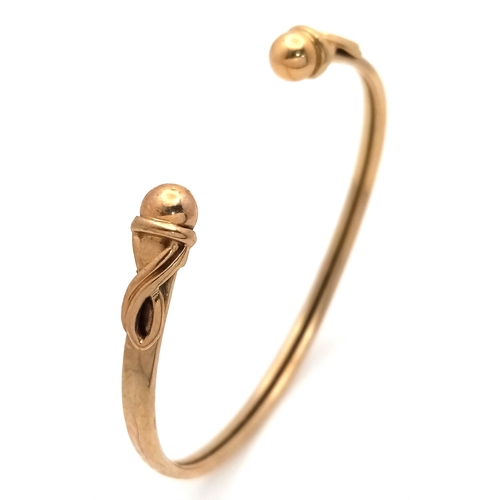186 - A 9K GOLD TORQUE BANGLE .     5.1gms