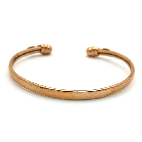 186 - A 9K GOLD TORQUE BANGLE .     5.1gms