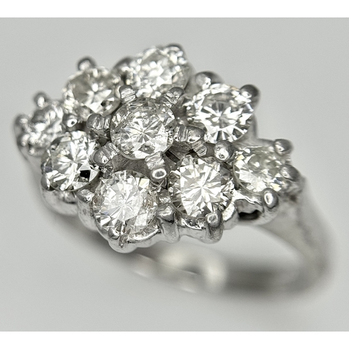 31 - AN 18K WHITE GOLD DIAMOND SET CLUSTER RING. 1.20CTW. 5.8G. SIZE J. SPSA-3009.