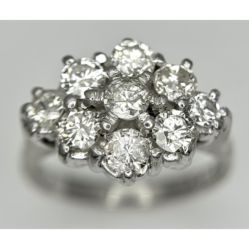 31 - AN 18K WHITE GOLD DIAMOND SET CLUSTER RING. 1.20CTW. 5.8G. SIZE J. SPSA-3009.