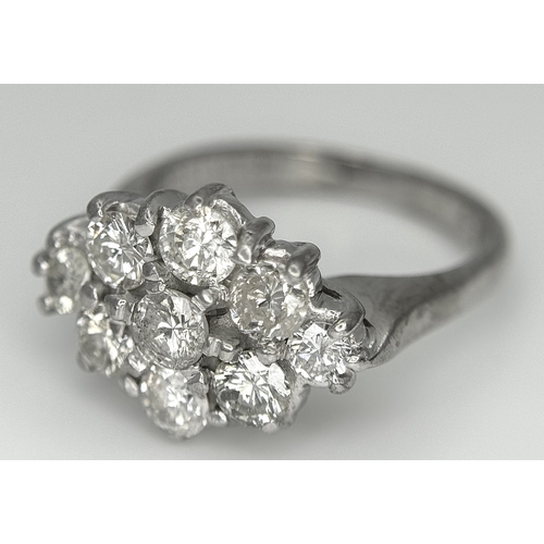 31 - AN 18K WHITE GOLD DIAMOND SET CLUSTER RING. 1.20CTW. 5.8G. SIZE J. SPSA-3009.