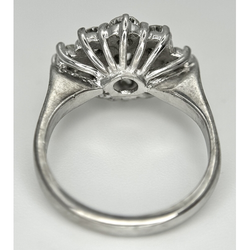 31 - AN 18K WHITE GOLD DIAMOND SET CLUSTER RING. 1.20CTW. 5.8G. SIZE J. SPSA-3009.