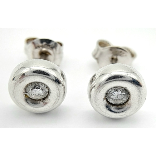 548 - A PAIR OF 18K WHITE GOLD RUB-OVER SET DIAMOND STUD EARRINGS. 0.30CTW. 2.1G. A/S 1312.