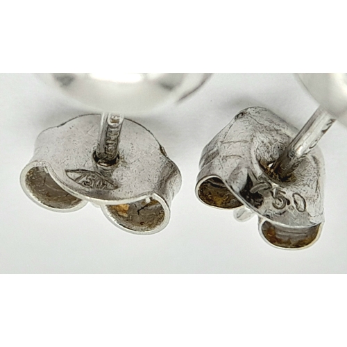 548 - A PAIR OF 18K WHITE GOLD RUB-OVER SET DIAMOND STUD EARRINGS. 0.30CTW. 2.1G. A/S 1312.